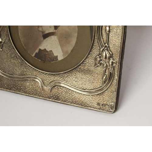 513 - Edwardian Art Nouveau silver photo frame, of square form, A J Zimmerman, Birmingham 1903. 15 cms squ... 