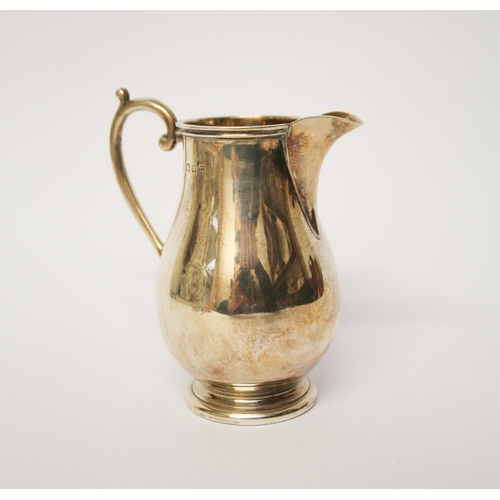 521 - A silver cream jug of plain form, Goldsmiths & Silversmiths Co,  London marks 1928, 4.75 troy ounces... 