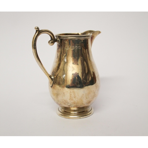 521 - A silver cream jug of plain form, Goldsmiths & Silversmiths Co,  London marks 1928, 4.75 troy ounces... 