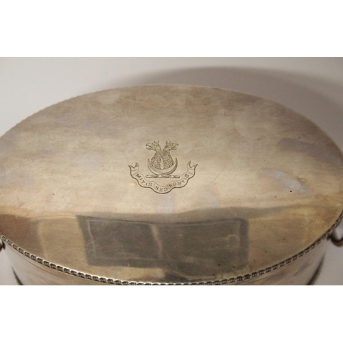 525 - A silver oval biscuit box, quite plain with simple beaded borders, stand-away hinged cover and well-... 