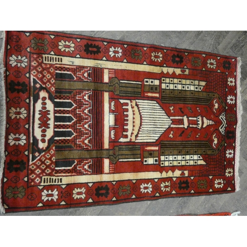 172 - A red and patterned design wool pile rug, 4'10 x 3' approximately