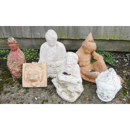 436 - A collection of three stone Buddha garden ornaments, a lion plaque etc - six in the lot