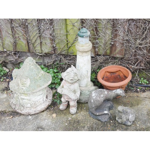 437 - Five various reconstituted stone ornaments and one terracotta garden ornament to include a lighthous... 