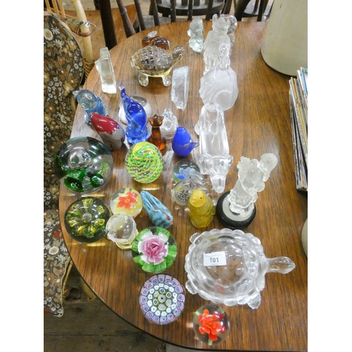 101 - A collection of assorted glass paperweights