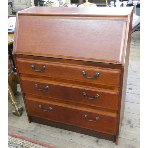 109 - A teak bureau with three long drawers under, 2'9 wide