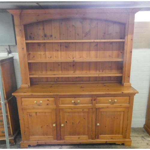 11 - A modern pine dresser with shelf back, three drawers and cupboards under, 5'6 wide