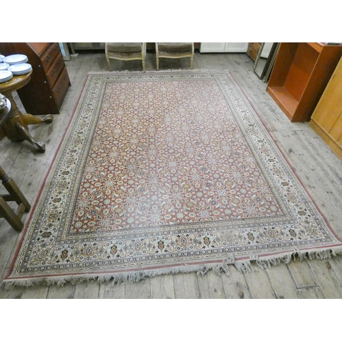 111 - A red and patterned Wilton carpet, 11'6 x 8'3