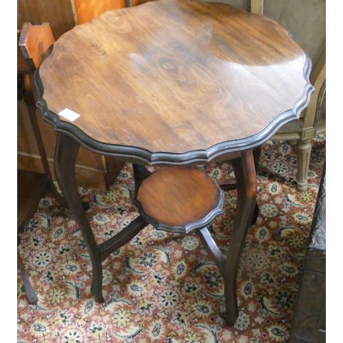 119 - An Edwardian walnut circular two tier occasional table