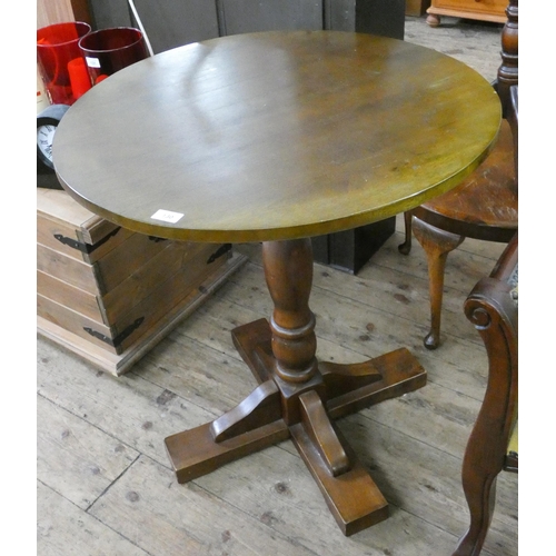 130 - A circular oak bar table on pillar base, 28