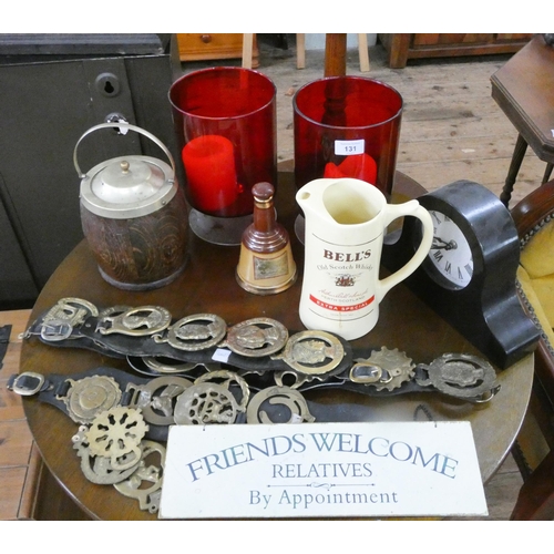 131 - A pair of red glass candle lamps, mantle clock, biscuit barrel, horse brasses, jug etc