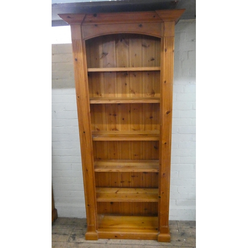 14 - A tall narrow pine open bookcase, 2'6 wide