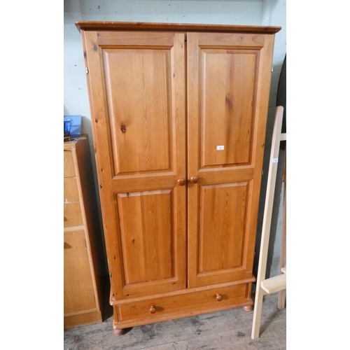 157 - A modern pine two door wardrobe with drawer under, 3' wide