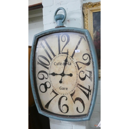 160 - A large blue metal framed French café wall clock in the shape of a pocket watch