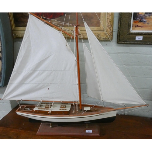 162 - A model sailing yacht on stand