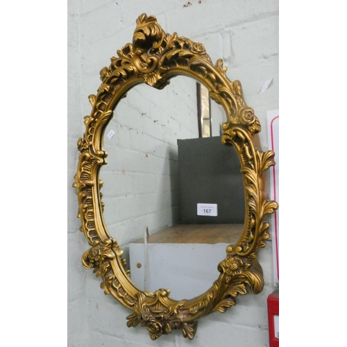 167 - An oval Victorian style wall mirror in gilt frame