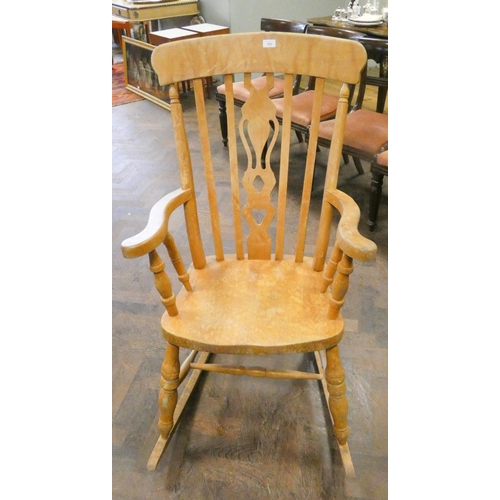 183 - A stripped Windsor rocking elbow chair with high slat back