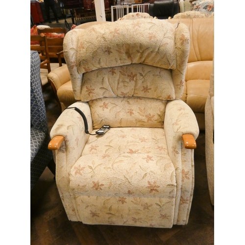 185 - An HSL rise and recline easy chair in fawn floral patterned covering