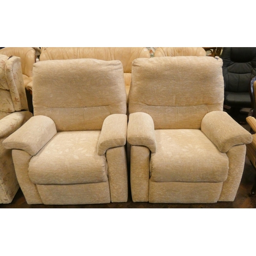 186 - A pair of GPlan easy chairs in pale fawn patterned covering, both are manual recliners