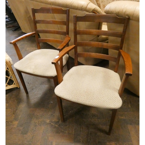 191 - A pair of teak ladder back elbow chairs with upholstered seats by GPlan