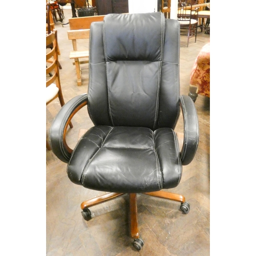 198 - A black revolving office elbow chair