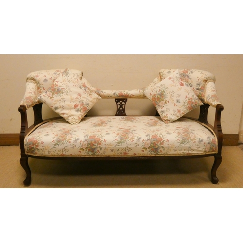 201 - A small Edwardian tub shaped upholstered settee with two loose cushions