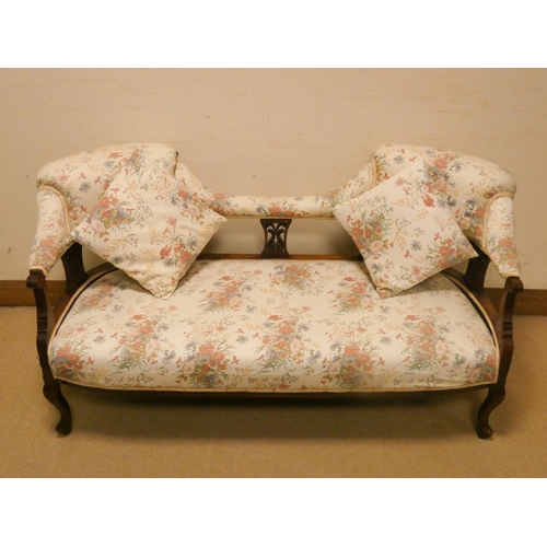 201 - A small Edwardian tub shaped upholstered settee with two loose cushions