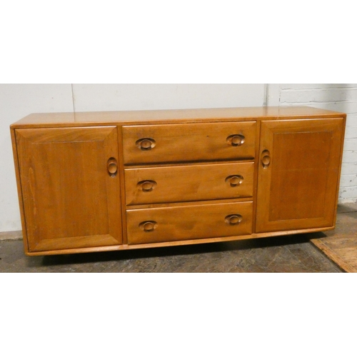 238 - An Ercol light elm low sideboard fitted three centre drawers and cupboards, 61