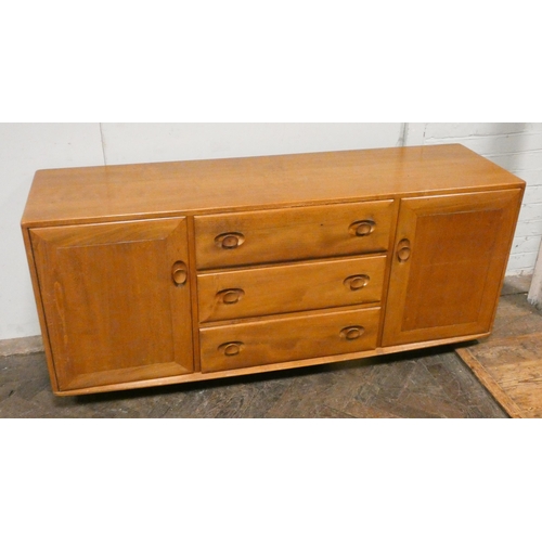 238 - An Ercol light elm low sideboard fitted three centre drawers and cupboards, 61