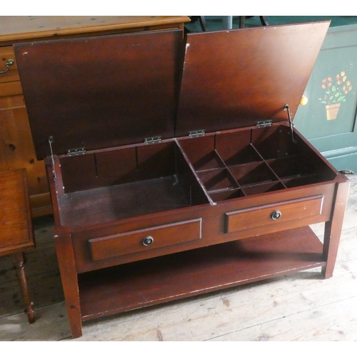 27 - A two tier long mahogany lift top coffee table