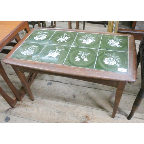 35 - A 1980's teak coffee table with green tile top