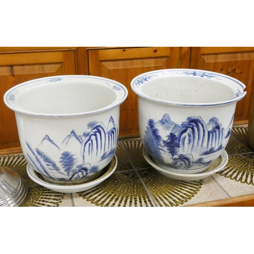 4 - Two Chinese style blue and white china jardinières with saucers (one damaged)