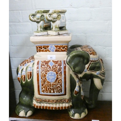 49 - A large decorative elephant plant stand and two small elephant stands