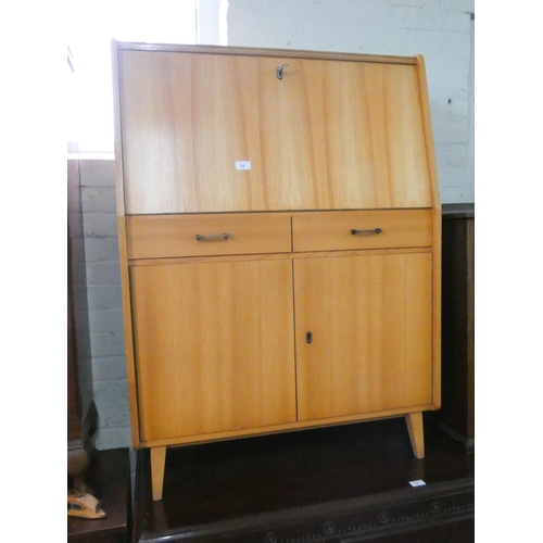 58 - A pale beech bureau with drawers and cupboards under, 34