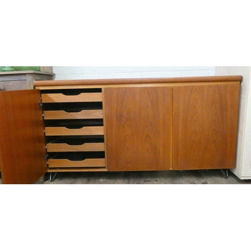 64 - A Rasmus Danish teak sideboard, fitted three cupboards and interior drawers, 61