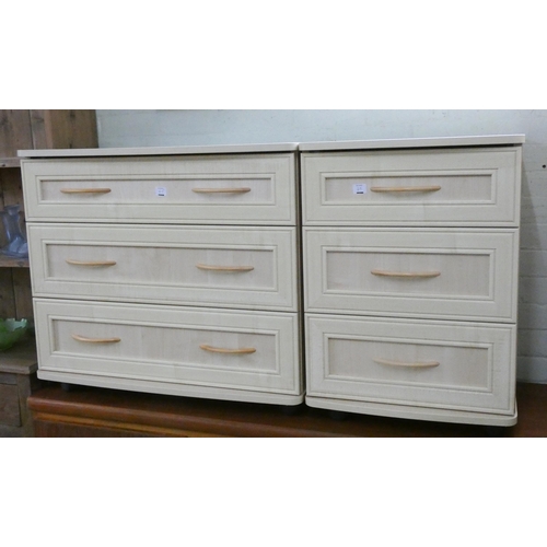 65 - A modern light wood two door wardrobe, a matching chest of three drawers and a matching three drawer... 