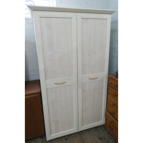 65 - A modern light wood two door wardrobe, a matching chest of three drawers and a matching three drawer... 