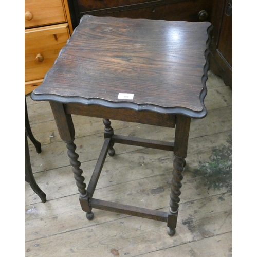 69 - A square oak occasional table with pie crust edge on barley twist legs