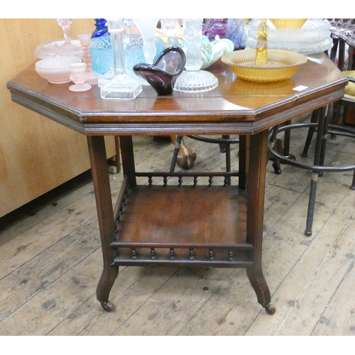 70 - A large Edwardian octagonal two tier walnut occasional table