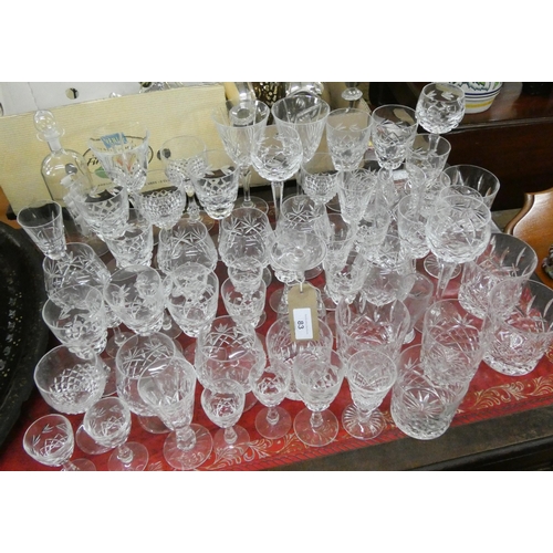 83 - Quantity of assorted cut wine glasses and a ship in a bottle