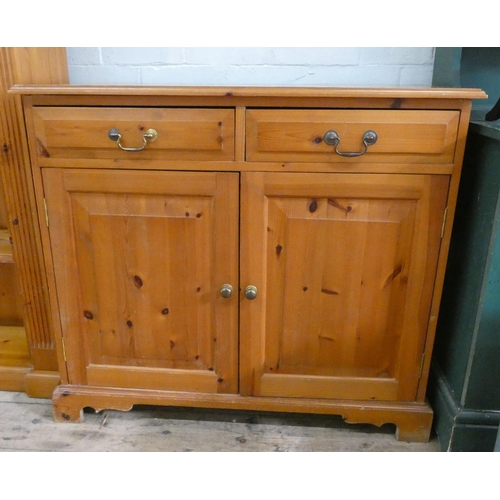 87 - A small modern pine sideboard, fitted two drawers and cupboards, 37