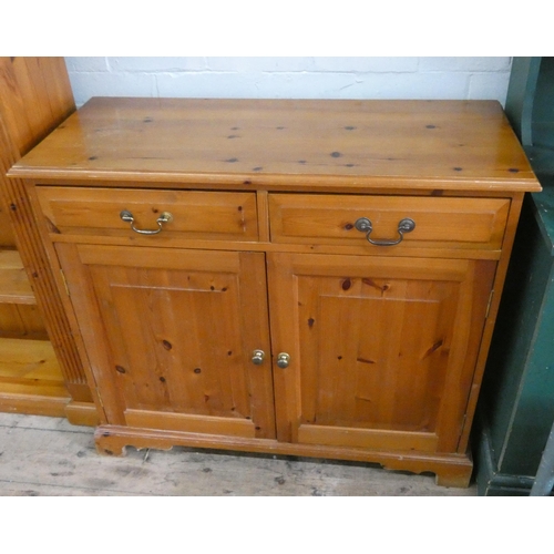 87 - A small modern pine sideboard, fitted two drawers and cupboards, 37