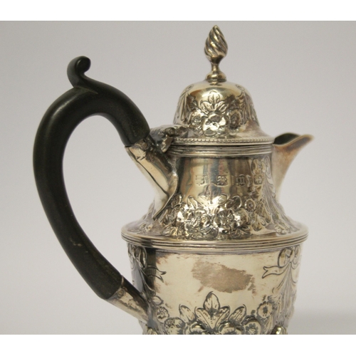 541 - A café au lait jug, with engraved and embossed floral swag decoration, on three paw feet. 14 cms tal... 