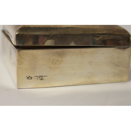 542 - An Edwardian  small silver cigarette box, 9.5 cms across