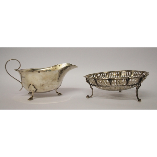 543 - A silver sauce boat and a pierced silver sweetmeat basket. 6.1 troy ounces.