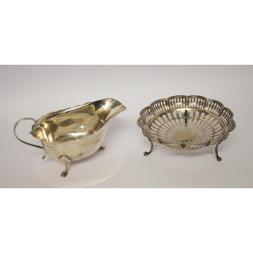 543 - A silver sauce boat and a pierced silver sweetmeat basket. 6.1 troy ounces.