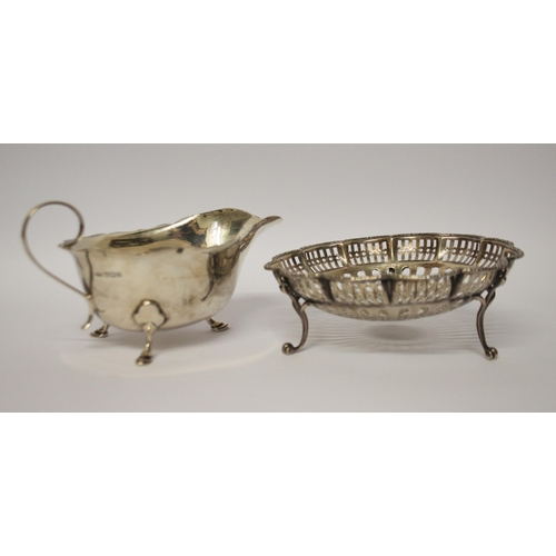 543 - A silver sauce boat and a pierced silver sweetmeat basket. 6.1 troy ounces.