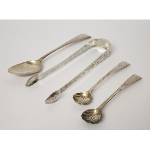 548 - Georgian silver -  sugar nips, pair of salt spoons and a teaspoon all with bright cut engraving.