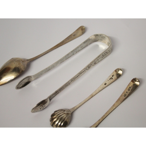 548 - Georgian silver -  sugar nips, pair of salt spoons and a teaspoon all with bright cut engraving.