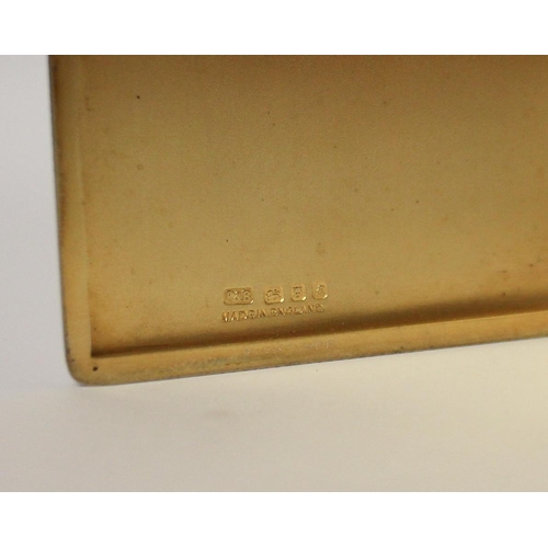 551 - A silver rectangular card case, with engine turned decoration and gilded interior. London hallmarks.... 