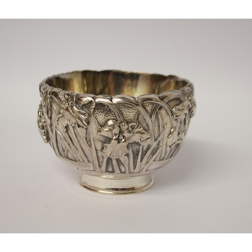 555 - A Japanese silver sugar basin, the exterior cast with iris, gilded interior. Character marks to base... 